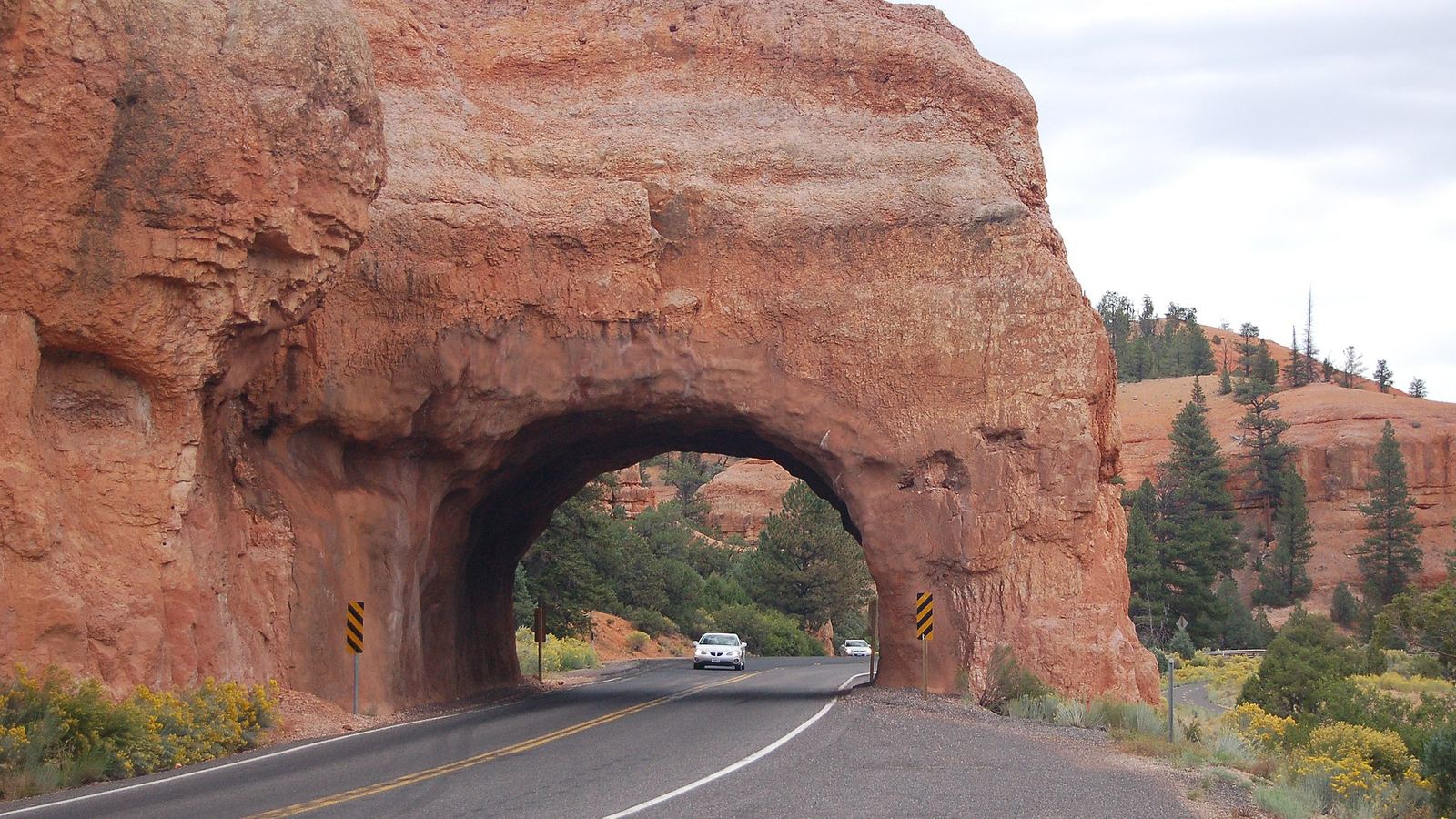 Scope and content: The original finding aid described this photograph as: Original Caption: A car is about to drive through one of the tunn